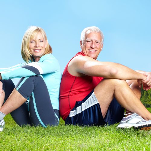 Senior healthy fitness couple. In the park.